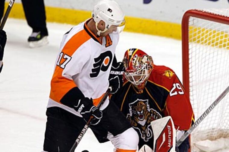 Florida Panthers goalie Tomas Vokoun blocks a shot by Jeff Carter, who scored twice for the Flyers. (AP Photo)