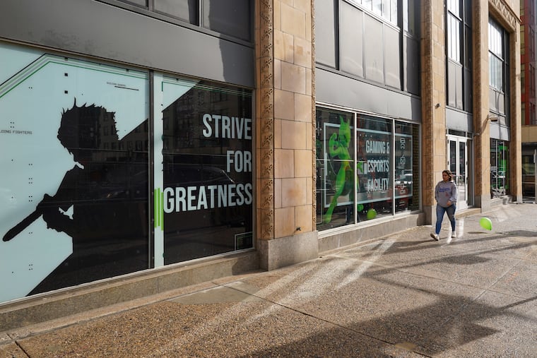 A pedestrian walks by The Block, Nerd Street Gamers' new establishment in Philadelphia. The Block is Nerd Street Gamers first esports campus where gamers of all levels can play vintage arcade-style games, computer games, and compete in tournaments for prizes.
