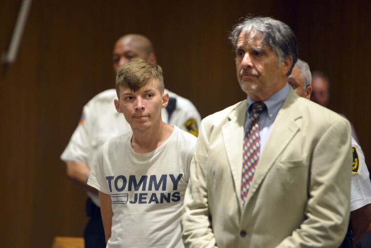 Volodymyr Zhukovskyy, 23, of West Springfield, stands with his attorney Donald Frank during his arraignment in Hampton District Court, Monday, June 24, 2019, in Springfield, Mass. Zhukovskyy, the driver of a truck in a fiery collision on a rural New Hampshire highway that killed seven motorcyclists, was charged Monday with seven counts of negligent homicide. (Don Treeger / The Republican via AP, Pool)