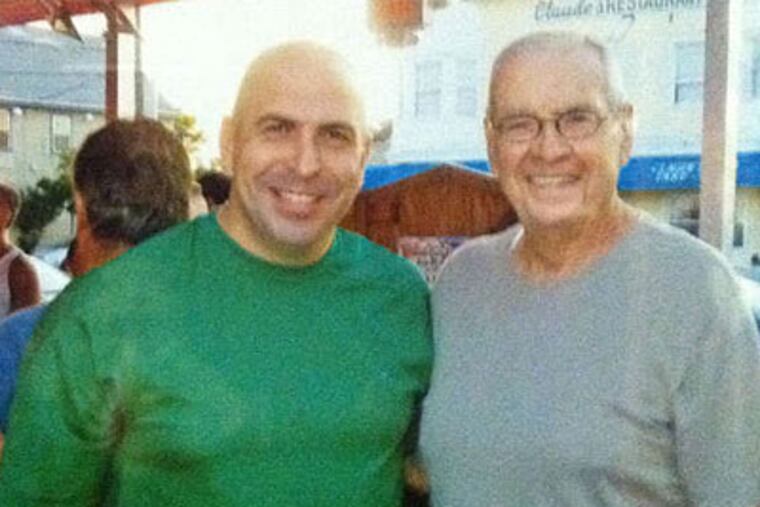 Firefighter Francis Cheney, warehouse-fire survivor, stands in this photo with his dad, Frank, a former Fire Department captain.