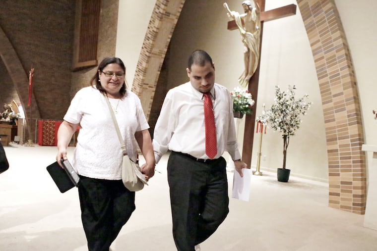 Susana Medina and son Luis Medina after he became a confirmed, official member of the parish at St. Joseph Pro Cathedral in Camden on May 26, 2015. (ELIZABETH ROBERTSON / Staff Photographer)