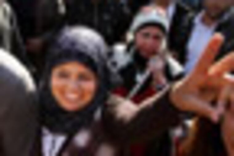 Samira Ibrahim, 25, flashes the victory sign during a rally supporting women's rights in Cairo, Egypt, Tuesday, Dec. 27, 2011. An Egyptian court has ordered the country's military rulers to stop the use of "virginity tests" on female detainees, a practice that has caused an uproar among activists and rights. Ibrahim filed a lawsuit after being subjected to a forced 'test." (AP Photo/Ahmed Ali)