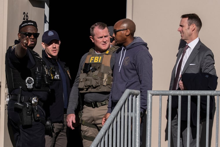 FBI agents are seen Wednesday at the Fulton County Election Hub and Operation Center in Union City, Ga, near Atlanta.