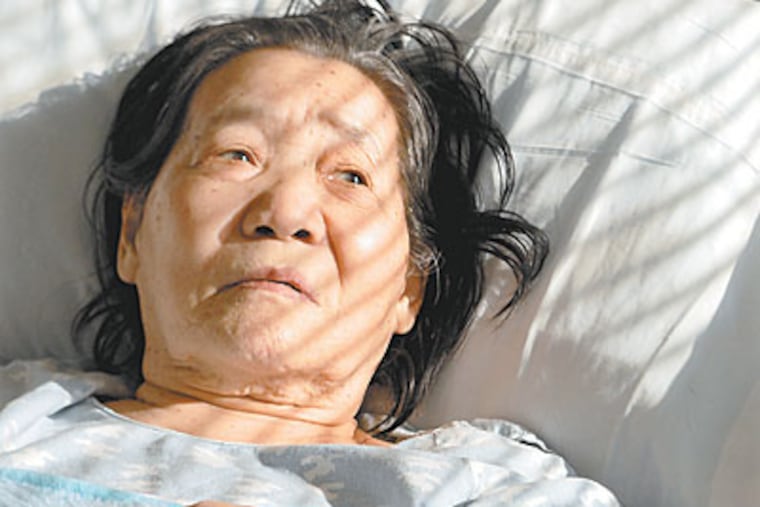 Soon Ja Kim at Abington Memorial Hospital in February. She stayed months beyond her discharge date, not visited by family and isolated by language. (TOM GRALISH / Staff Photographer)
