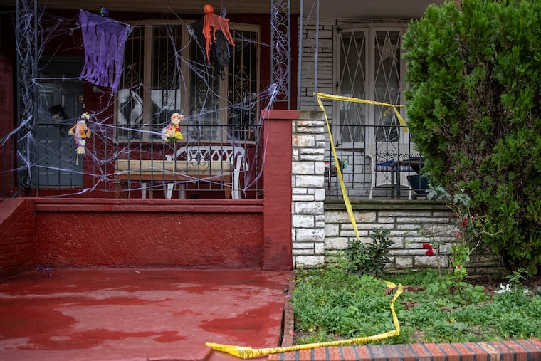 The home on the 5000 block of Walton Avenue in West Philadelphia was blocked off with police tape the day after a quadruple shooting in 2019. Maurice Louis, 29, was charged in the shooting deaths of his mother, his stepfather, and two brothers.