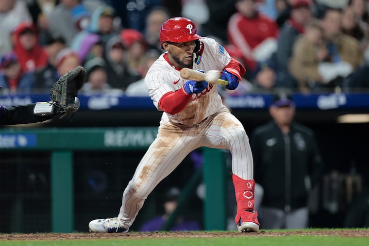 Phillies outfielder Johan Rojas bunts in a game against the Colorado Rockies on April 2.