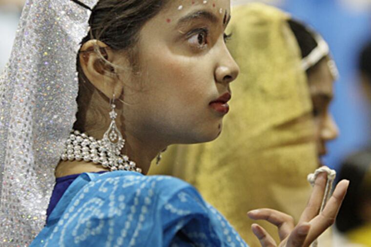 Divya Sivakumar waits to perform in the Ram Leela-a dance drama from the movie Swades during the Diwali Program at Lionville Community YMCA in Exton, Chester County. ( Elizabeth Robertson / Inquirer )