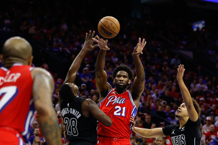 Joel Embiid passes out of a double-team to P.J. Tucker. If Embiid remains composed and selfless, the Sixers might go all the way.