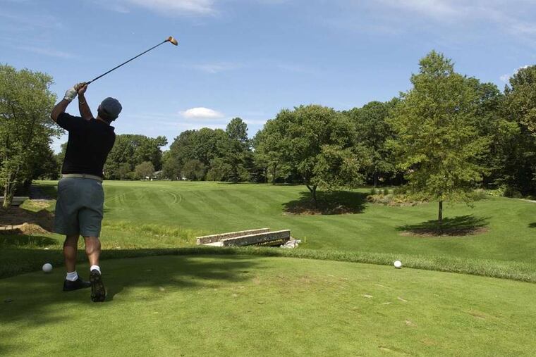 A golfer taking a swing at Woodcrest Country Club in Cherry Hill in 2003. The club filed for Chapter 11 bankruptcy last year and did not open this season.