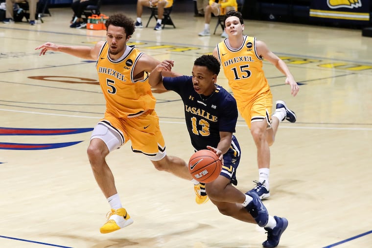 Jhamir Brickus (13) made two three-pointers to extend La Salle's lead from one to seven in the second half.