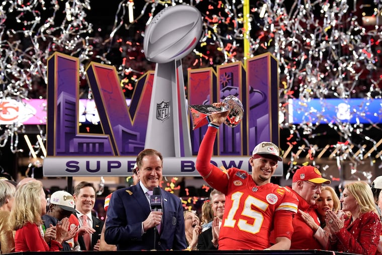 Kansas City Chiefs quarterback Patrick Mahomes hoists the Vince Lombardi Trophy (again) after the overtime victory against the San Francisco 49ers in Super Bowl LVIII.