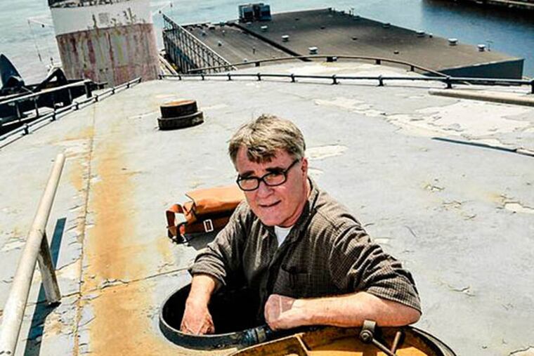 David Macaulay emerges from the fore funnel, one of the two funnels that help define the SS United States' imposing profile, during a 2013 visit. PHOTO: Kyle Ober