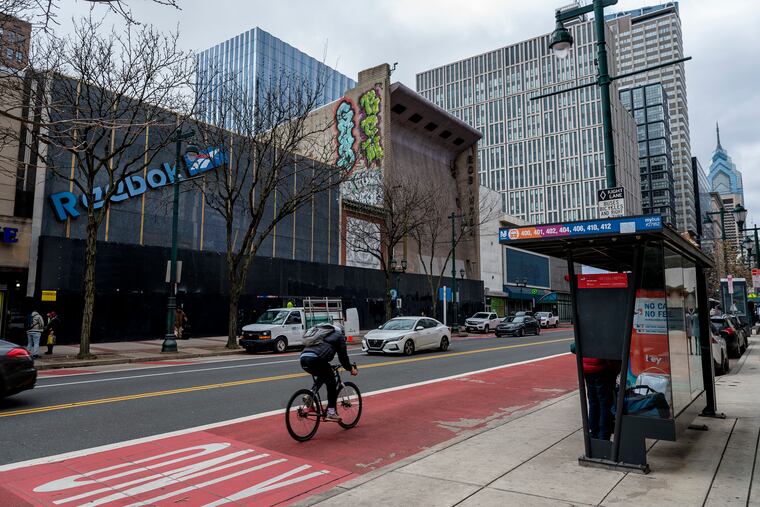 The south side of the 1000 block of Market Street Jan. 24, 2024. The former Robinson department store (center, with graffiti) stands where part of the new 76ers-proposed housing development would go.