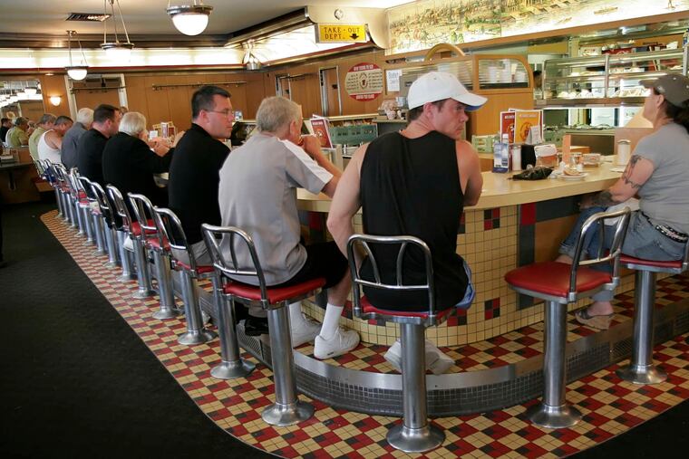 Patrons pack the counter at the Melrose Diner in South Philadelphia. "It was literally minor, very minor things," manager Renee Sheeran said. "Everything was corrected immediately."