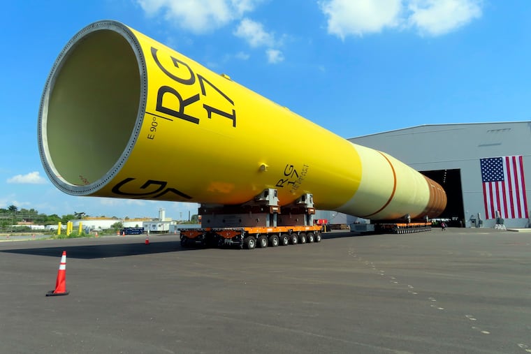 A huge foundation for an Orsted offshore wind turbine, called a monopile, sits atop wheeled movers in Paulsboro in July. The Danish wind energy developer Ørsted scrapped its Ocean Wind I and II projects off southern New Jersey due to problems with supply chains, higher interest rates and a failure to obtain desired tax credits.