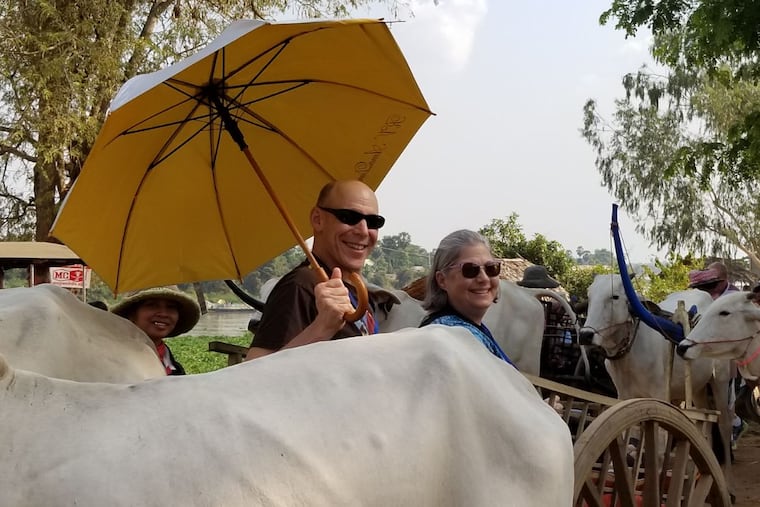 Travel agent Susan Wolfson and husband David in the Cambodian countryside during a Mekong Delta cruise that many seniors travel.