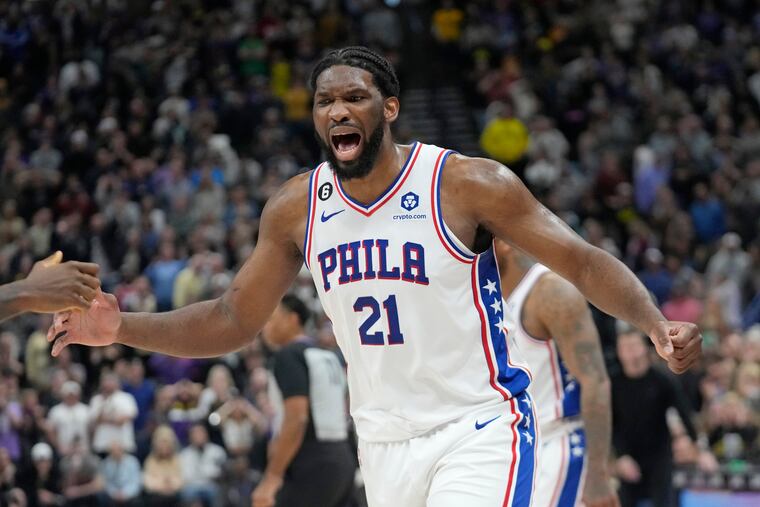 Sixers center Joel Embiid celebrates following a win over the Utah Jazz on Saturday. Embiid had the game-winning bucket.