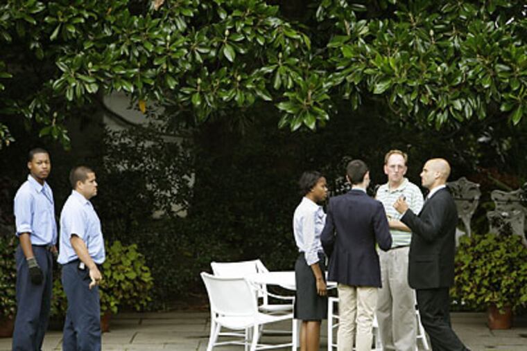 White House staffers prepared the Rose Garden for President Obama's meeting with Harvard professor Louis Gates and the Cambridge police officer who arrested him. (Alex Brandon/AP)