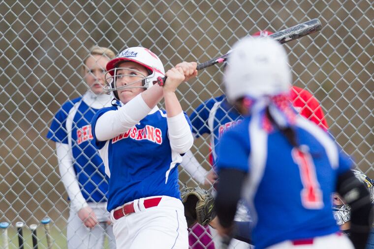 Neshaminy's Lauren Quense watches as her 2 run homer goes over the fence in the 5th inning. Neshaminy beat Bensalem 15-2 in girls softball action tThursday afternoon at Bensalem.( ED HILLE / Staff Photographer )