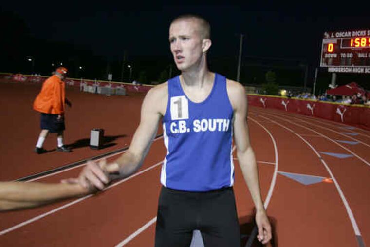 Tom Mallon of Central Bucks South gets a hand after winning the boys' 800 meters with the fastest high-school time posted outdoors in the nation this season.