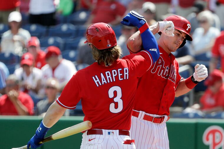 The Phillies' J.T. Realmuto celebrated his first-inning solo home run with teammate Bryce Harper against the Pittsburgh Pirates in a spring training game in Clearwater, Fla., in March.