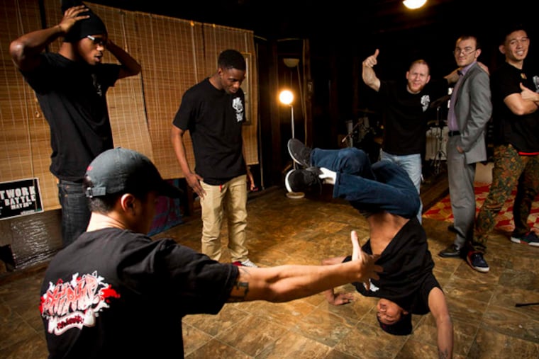 At right rear are Steve Lunger (left), Aaron Trois, and Mark Wong, organizers of Hip Hop Fundamentals. In foreground are company dancers.