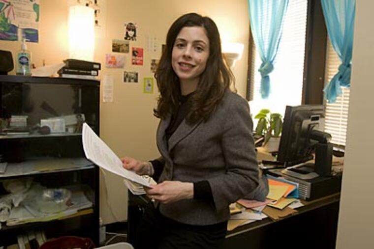 Laura Spagnoli teaches French and edits a literary magazine at Temple. Not quite satisfied, she has turned to writing fiction. (Ed Hille / Staff Photographer)