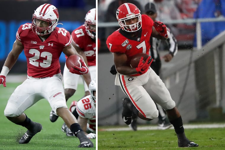 Local stars Jonathan Taylor (left) and D'Andre Swift were each taken in the second round of the NFL draft on Friday.