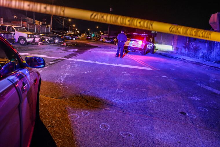 Police at the scene where a 62-year-old man was shot twice in the abdomen in the 2000 block of Point Breeze Avenue.