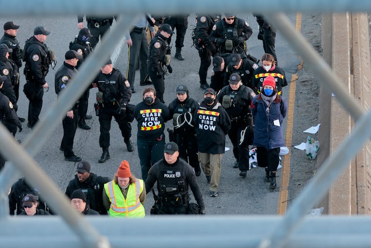 Civil disobedience demonstration. to demand a cease-fire in Gazatook place on The Benjamin Franklin Parkway on Dec. 14, 2023. Protesters blocked traffic and police made arrests.