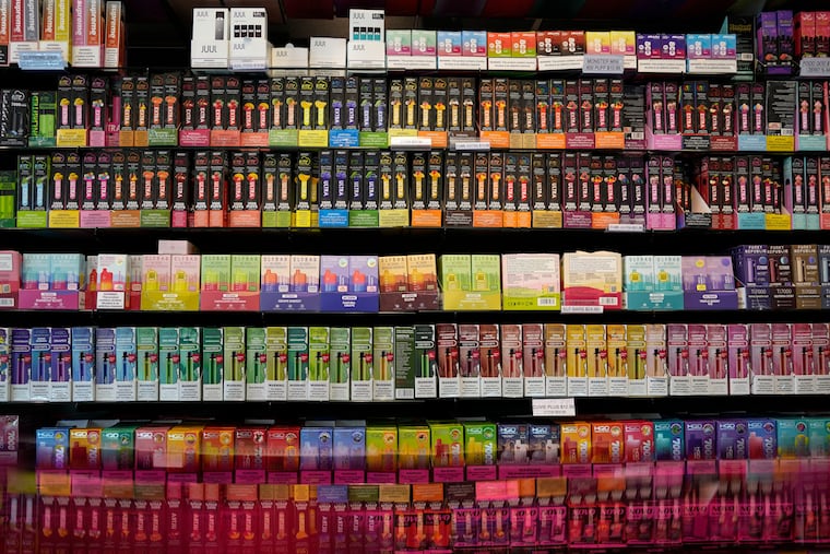 FILE - Disposable flavored electronic cigarette devices are displayed for sale at a store in Pinecrest, Fla., June 26, 2023. (AP Photo/Rebecca Blackwell, File)