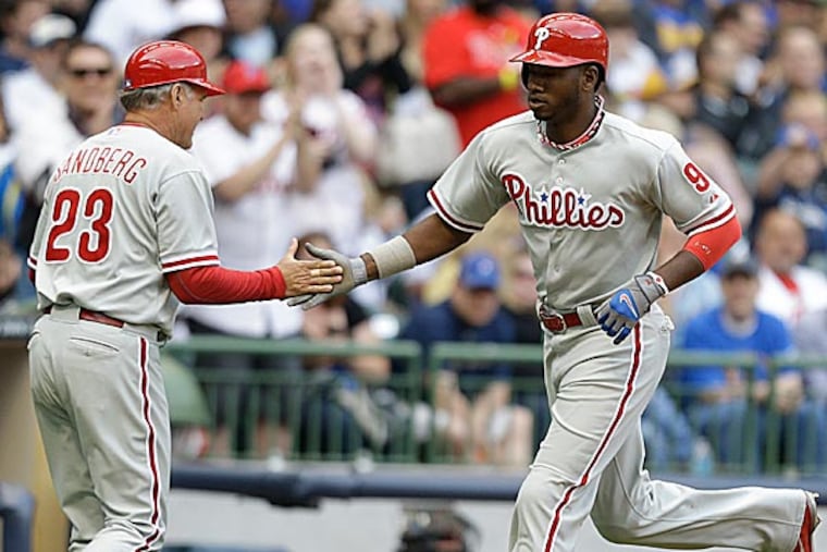 While Domonic Brown has seized his everyday spot in Charlie Manuel's lineup, the manager has three outfielders for two spots. (Jeffrey Phelps/AP)