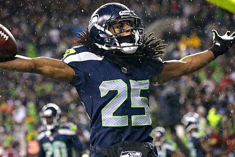 Seattle Seahawks' Richard Sherman motions to fans after intercepting in the end zone against the San Francisco 49ers in the second half of an NFL football game, Sunday, Dec. 23, 2012, in Seattle. (Elaine Thompson/AP)