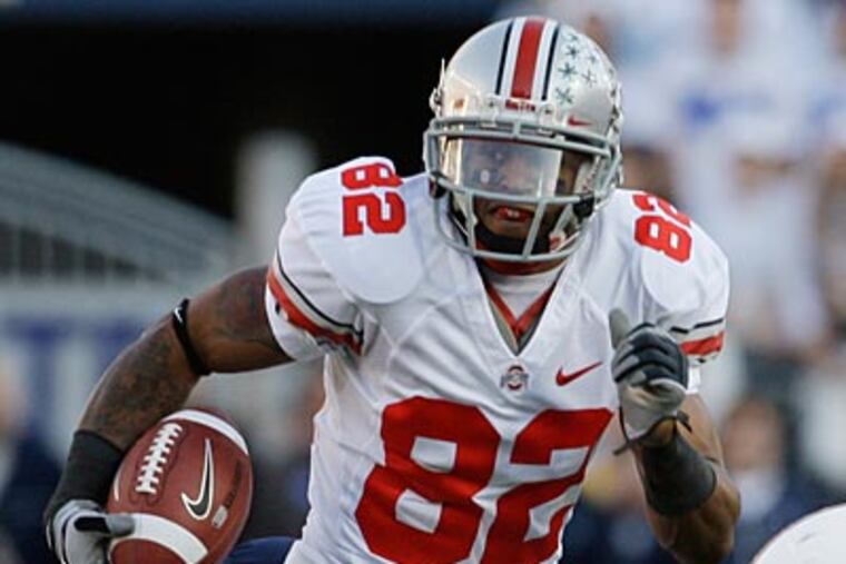 "We had four Big Ten rings. There was enough to go around," Ray Small said. (Carolyn Kaster/AP file photo)