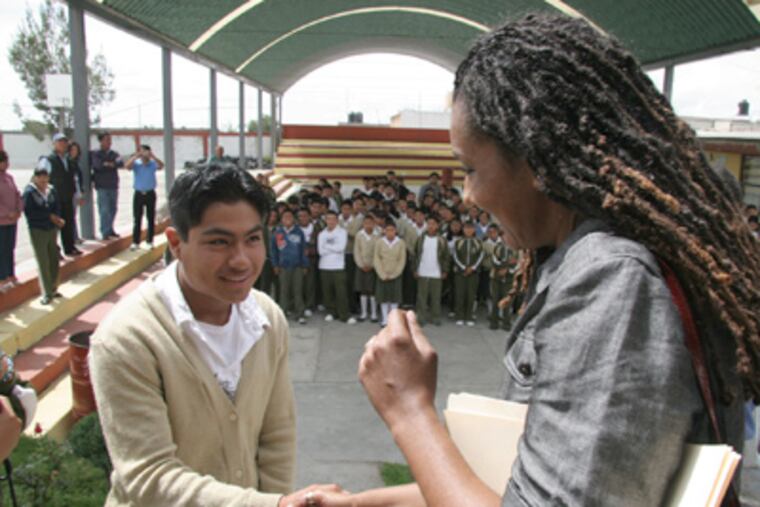 Philly's first lady, Lisa Nutter, meets with a student in San Mateo Ozolco, Mexico, during her June 2010 trip with the Siembra Azul Foundation. (DAVID SURO)