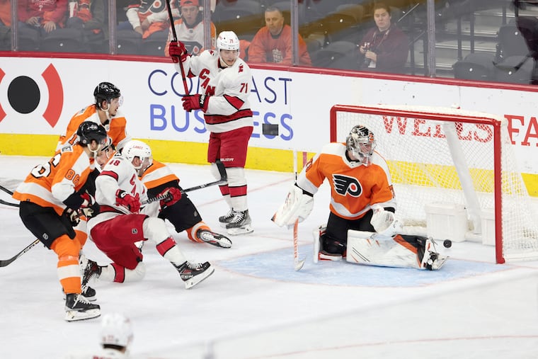 Flyers goalie Carter Hart watches as the Hurricanes' second goal of the game flies into the net on Saturday. Jordan Martin scored the goal.