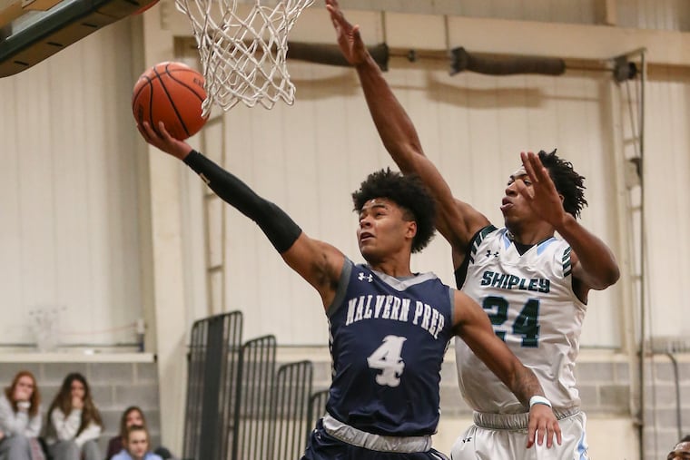 Malvern Prep's Deuce Turner goes to the basket with Shipley's Ray Somerville during the 1st quarter in Bryn Mawr, Friday, December 14, 2018. Shipley beats Malvern Prep 71-59. STEVEN M. FALK / Staff Photographer