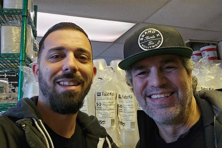 Marple resident Mike Gentile takes a selfie with actor Mark Ruffalo on Wednesday at A Cut Above Deli in Newtown Square, Pa. Ruffalo is in the area for 'Task', a forthcoming crime series from the creator of 'Mare of Easttown'.