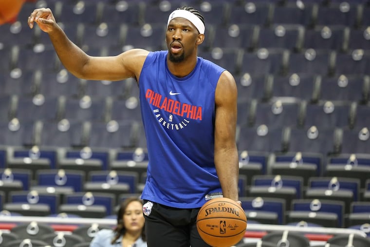 Joel Embiid warms up before a game against the Washington Wizards at the Capital One Arena in Washington, D.C., on Wednesday.