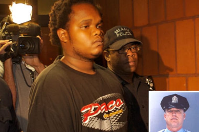 John Lewis, the alleged killer of a Philadelphia Police officer Cassidy (inset), when he was escorted out of the the Miami Police Dept during his arrest. ( John Costello / Inquirer )