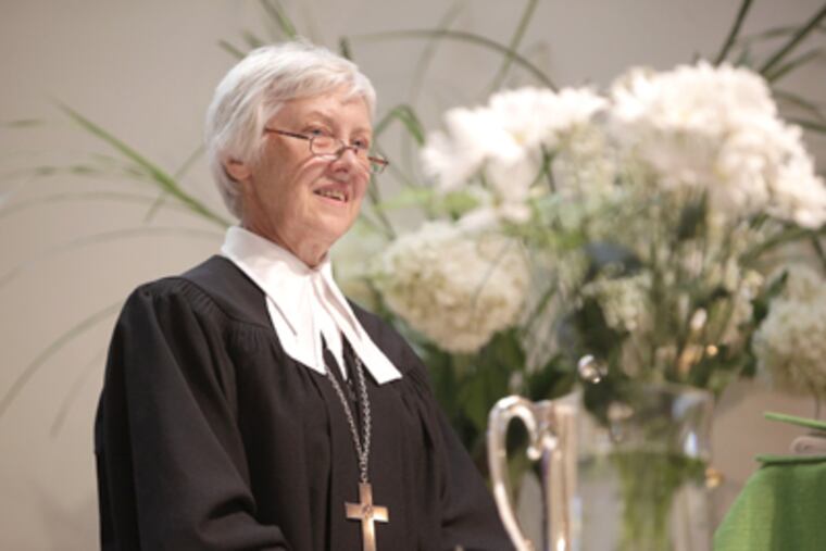 Pastor Ieva Dzelzgalvis greets the congregation at Latvian Evangelical Lutheran Church of St. John in Newtown Square. (David Swanson / Staff Photographer)
