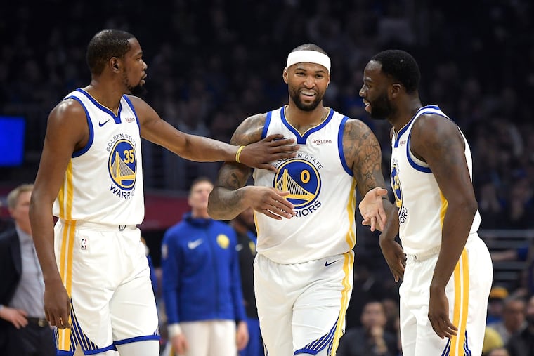 Golden State teammates (from left) Kevin Durant, DeMarcus Cousins, and Draymond Green enjoying a light moment against the Clippers earlier this month.