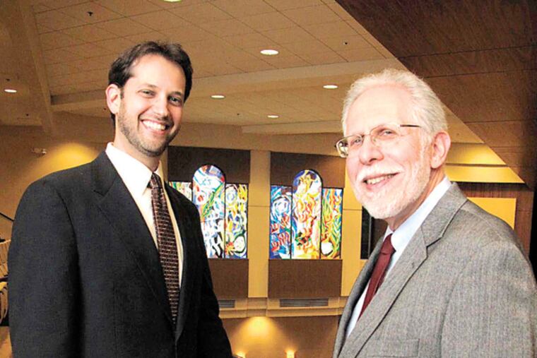 Rabbi Micah Peltz, left, has succeeded Rabbi Steven Lindemann as the third senior rabbi in the 74-year history of Cherry Hill's Temple Beth Sholom. (David O'Reilly/Staff)