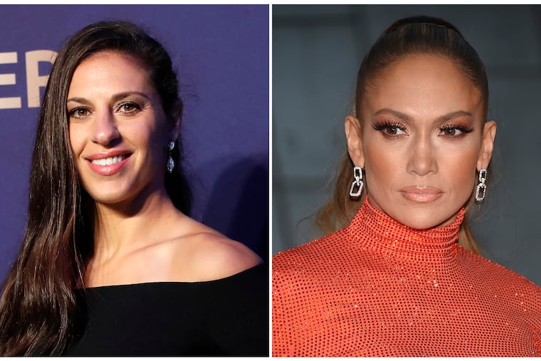 In this combination of file photos Carli Lloyd smiles prior to the women's soccer World Cup France 2019 draw, in Boulogne-Billancourt, outside Paris, on Dec. 8, 2018 and Jennifer Lopez attends the CFDA Fashion Awards at the Brooklyn Museum on June 3, 2019, in New York. Lloyd of the U.S. women's national soccer team celebrated her recent World Cup victory with a lap dance from J. Lo. Lopez pulled Lloyd from the audience to the stage at Madison Square Garden in New York on Friday, July 12, 2019, working her sensual moves on the soccer star. (AP Photo)