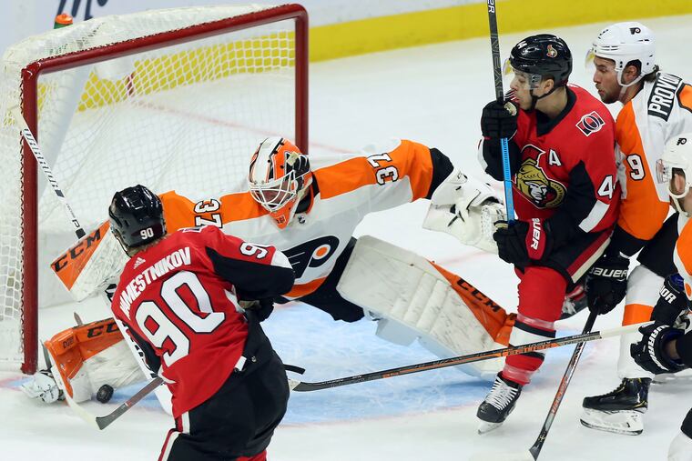 Flyers goaltender Brian Elliott made 17 saves in the first period on Saturday, including this beauty on Ottawa's Vladislav Namestnikov.