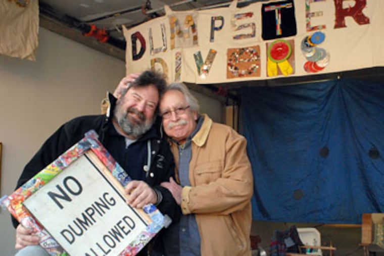 A group of artists called "Dumpster Divers" has taken over a South Street storefront for a galllery. Here. co-founders Neil Benson, left; and Joel Spivak at the gallery. (April Saul / Staff Photographer)