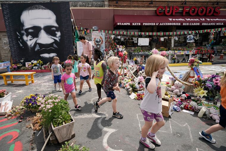 Preschool children visit the site where George Floyd was murdered by then-Minneapolis police officer Derek Chauvin.