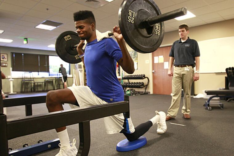 The Sixers' Nerlens Noel lifts weights at Champion Sports Medicine at St. Vincent's Hospital in Birmingham, Al., Wednesday August 28, 2013. (David Swanson/Staff Photographer)