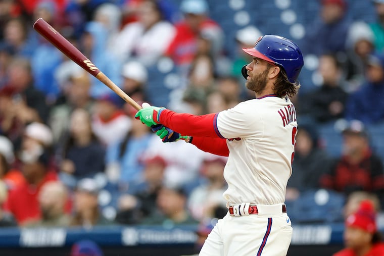 Phillies Bryce Harper watches his second-inning solo home run Saturday against the Mets.