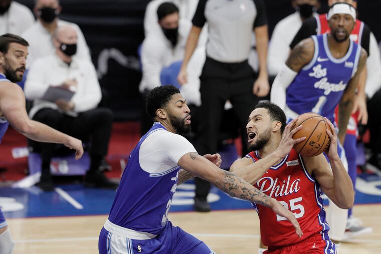 Ben Simmons works against Lakers defender Anthony Davis.